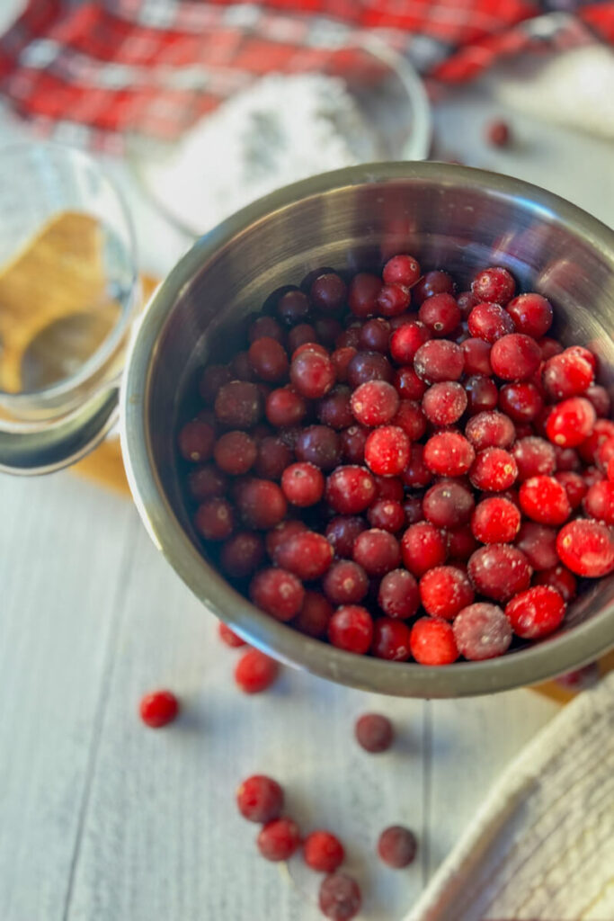 Overhead view of a metal bowl of cranberries