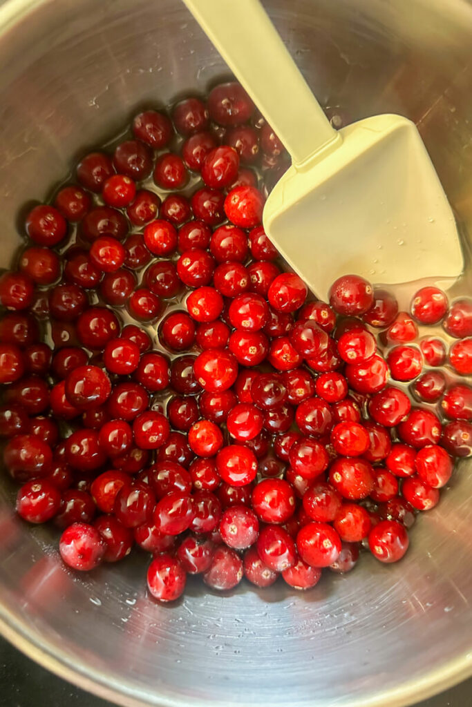 Overhead view of cranberries being stirred