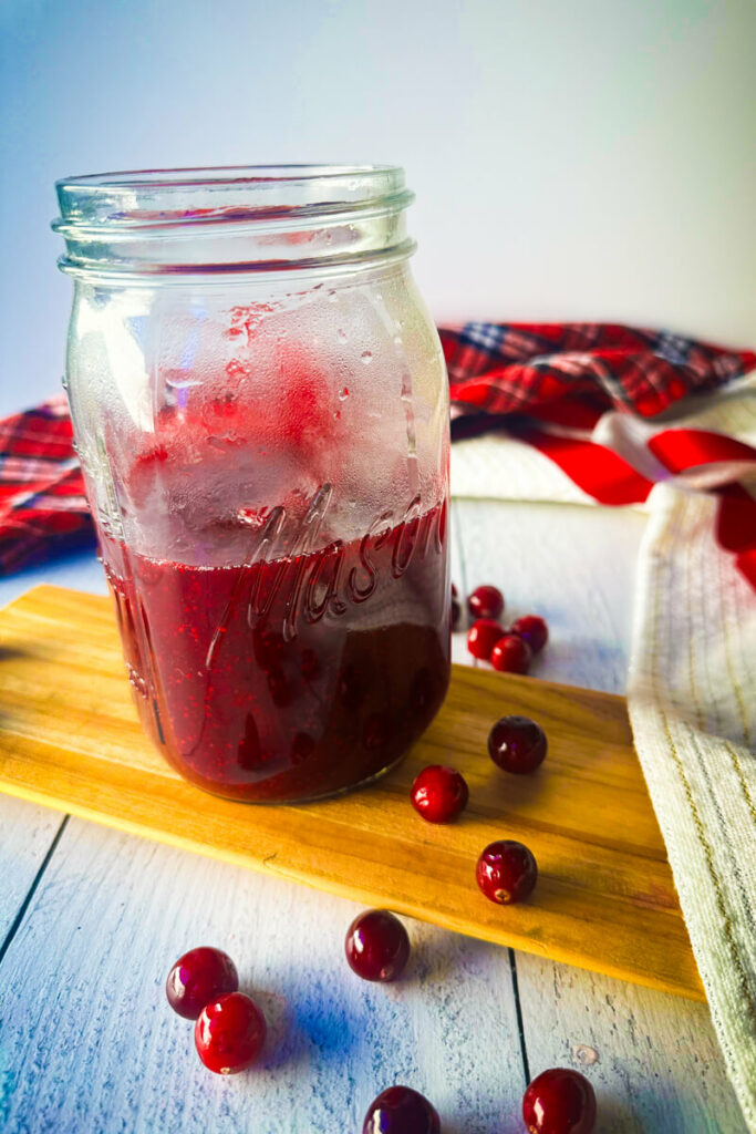 Overhead view of mason jar of keto cranberry sauce