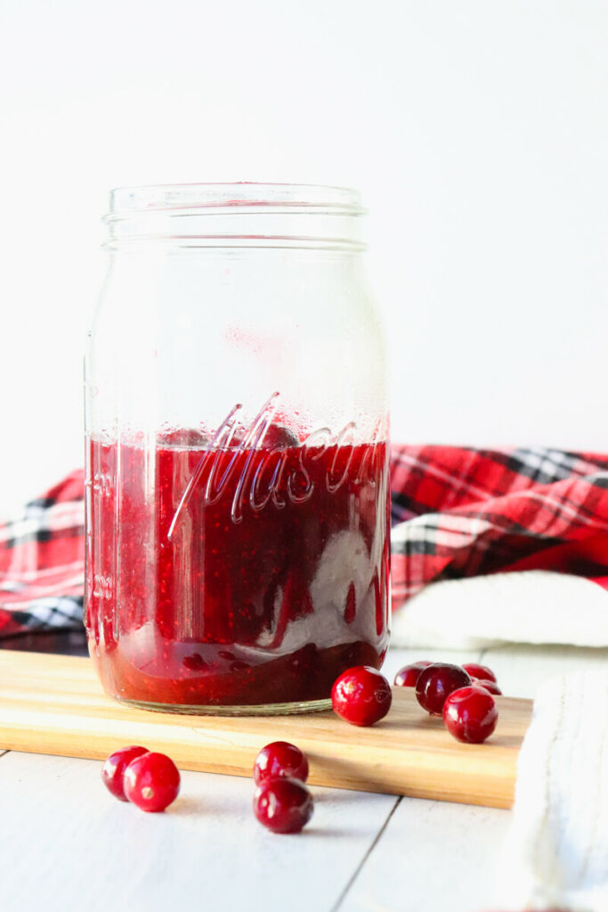 Front view of mason jar and keto cranberry sauce