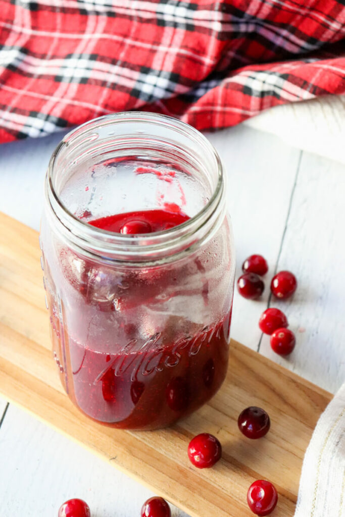 Overhead view of mason jar of keto cranberry sauce