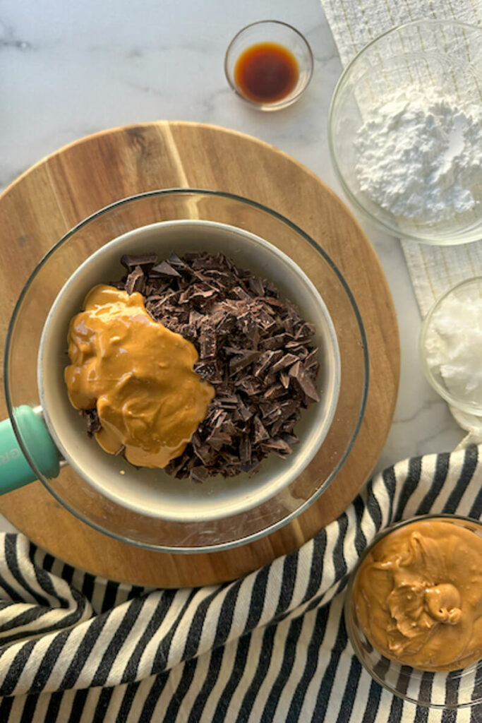 Overhead view of a glass bowl of chocolate with peanut butter