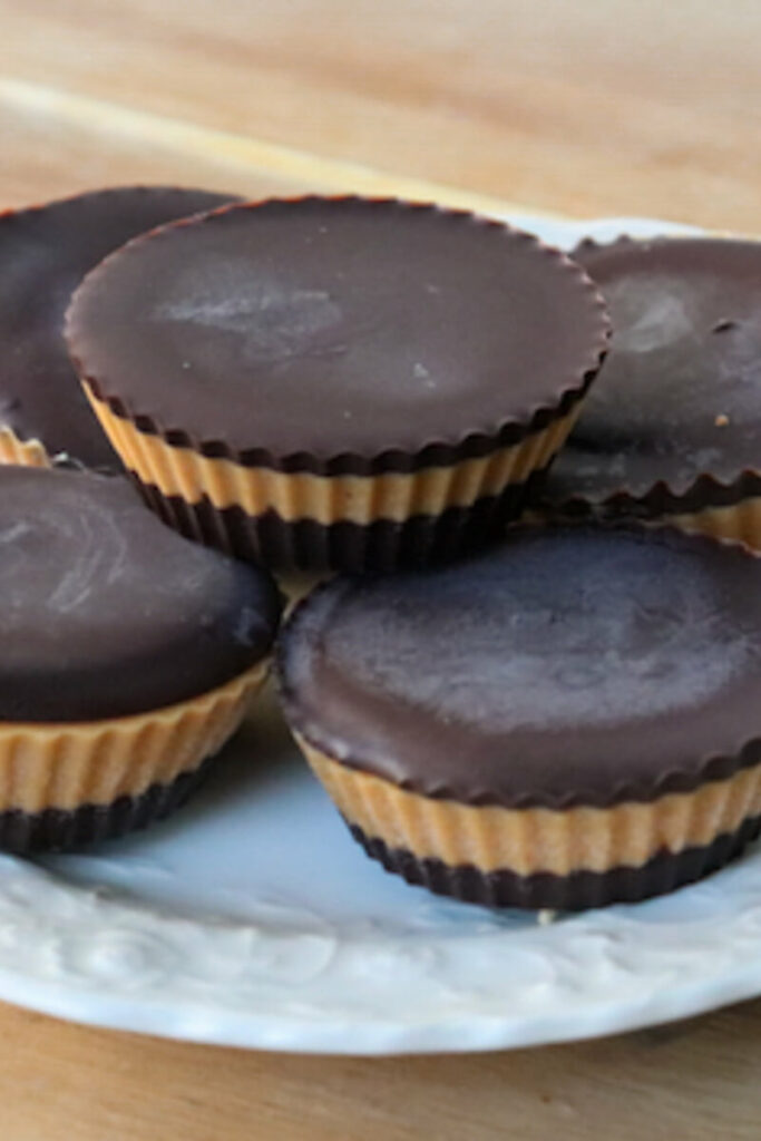 A stack of low carb peanut butter cups on a white plate