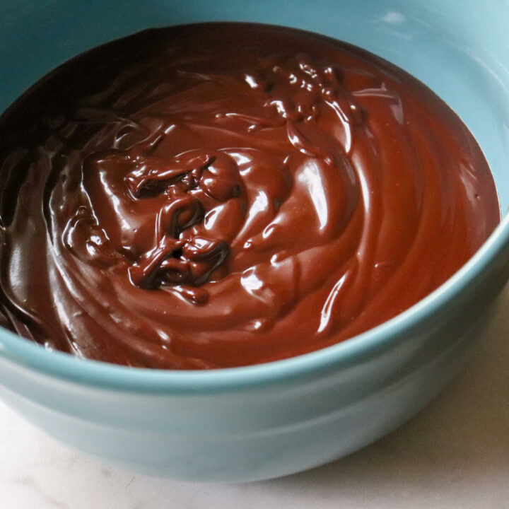 Overhead view of a blue bowl of keto chocolate ganache.