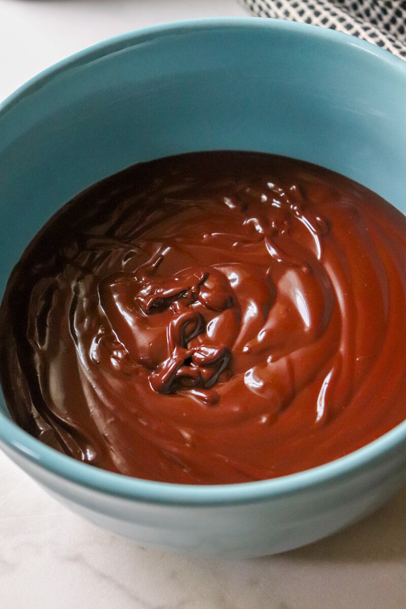 Overhead view of a blue bowl of keto chocolate ganache.