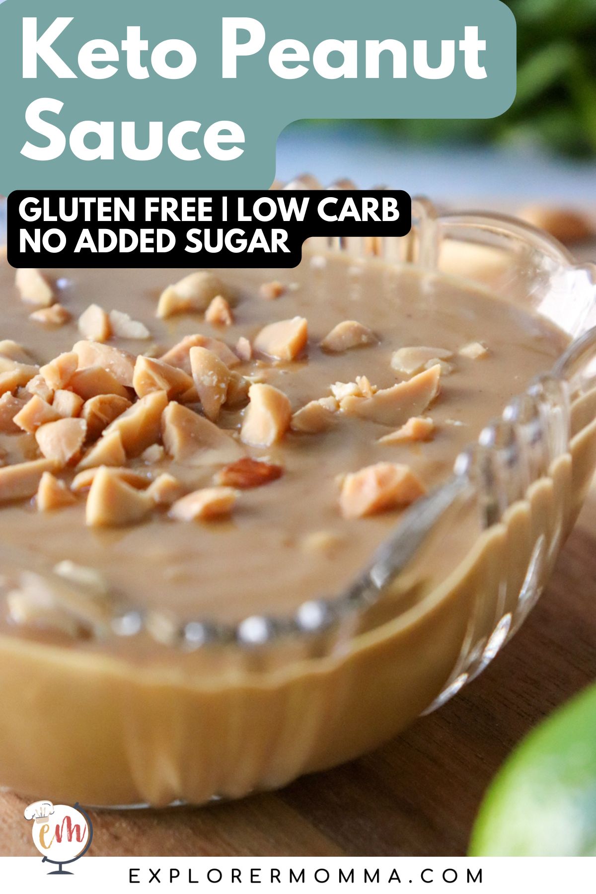 A close up of a glass bowl of low carb Thai peanut sauce sprinkled with extra peanuts