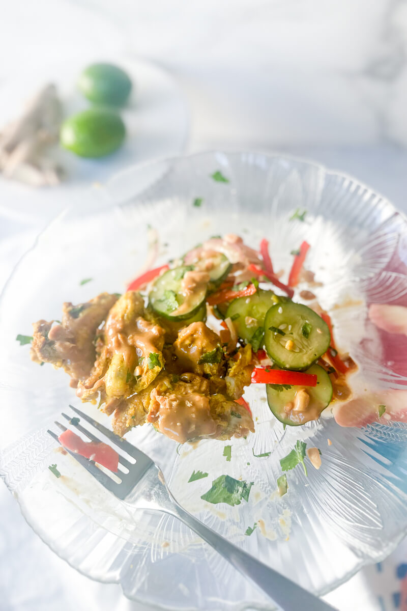 Chicken satay off the skewers with Thai cucumber salad and peanut sauce