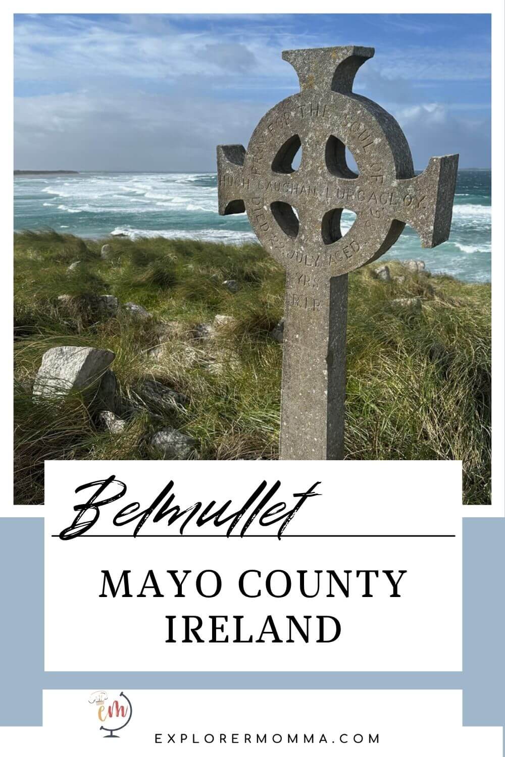 View of a Celtic cross at a cemetery with grasses blowing in the wind overlooking the beach and Atlantic Ocean. Belmullet, County Mayo Ireland