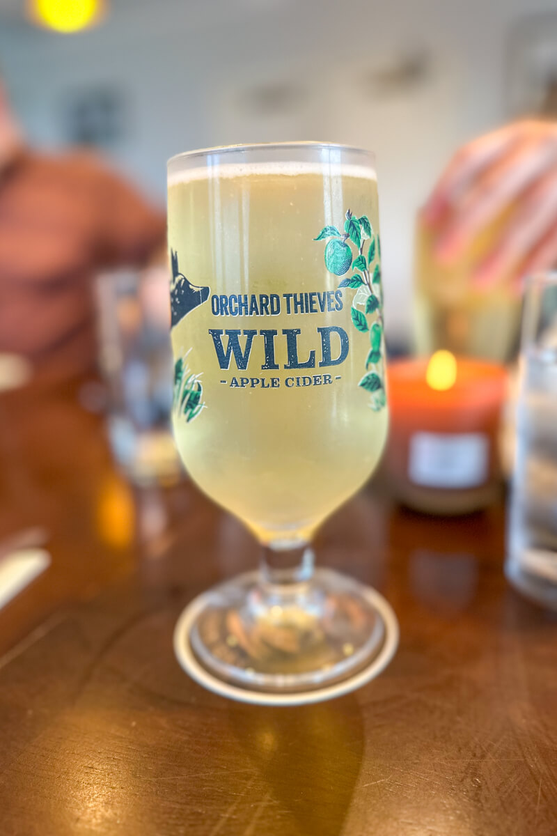 A front view of my half pint glass of Orchard Thieves Cider