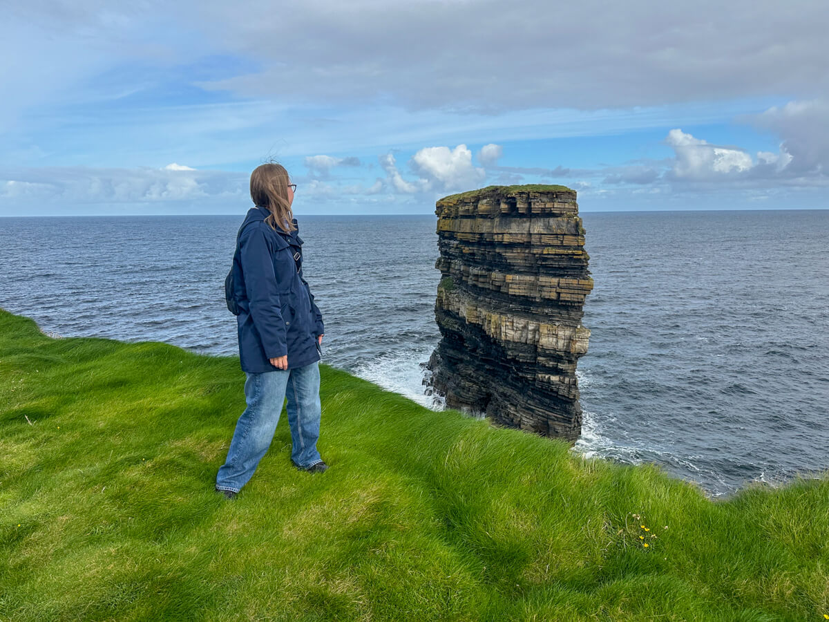 Lauren looking Dún Briste, the sea stack at Downpatrick Head, Ireland