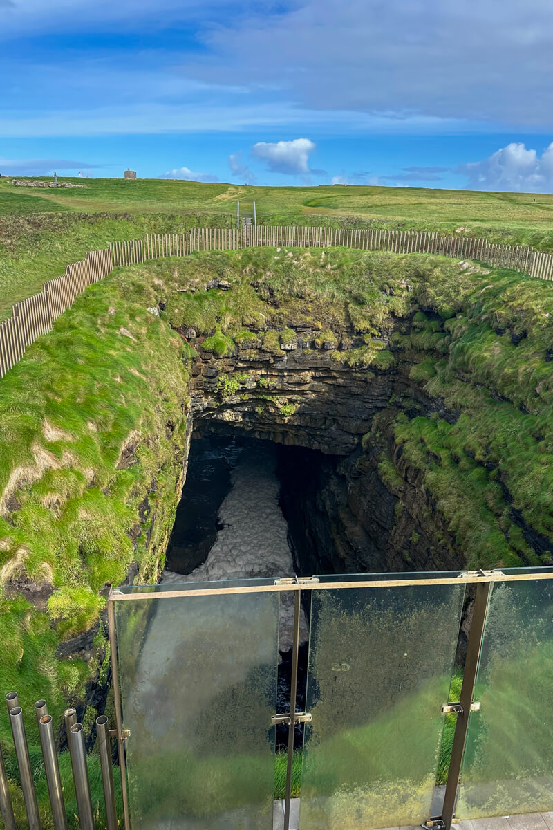 Poll Na Seantainne - the blowhole that plummets down to the ocean below at Downpatrick Head.