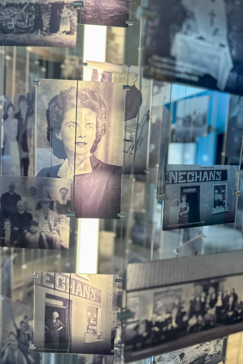 A display of hanging pictures lit up of people who lived, visited, and had an impact on the area in this part of Mayo Ireland.