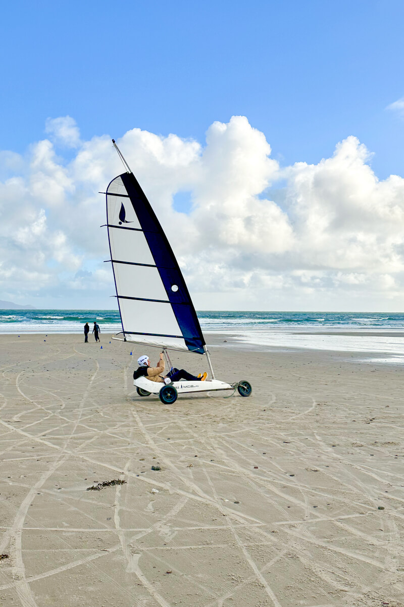 A man in a land sail on Keel Beach