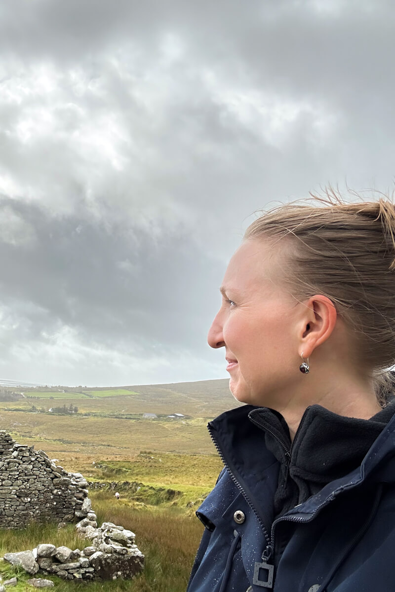 Lauren looking out into the distance at the deserted village on Achill Island