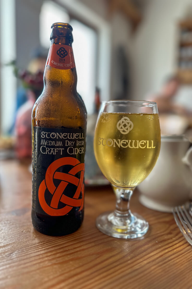 A glass and bottle of Stonewell Cider.