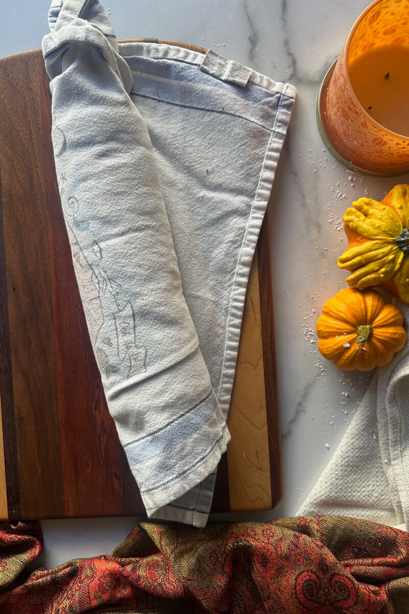 Overhead view of the keto pumpkin sponge cake rolled in a towel