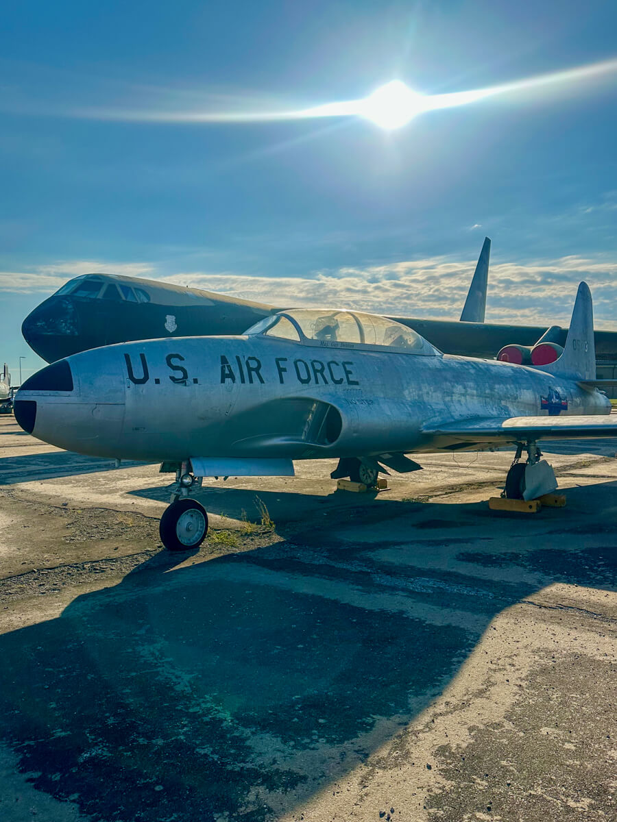 Front view of a small silver airplane with U.S. Air Force stenciled on the side