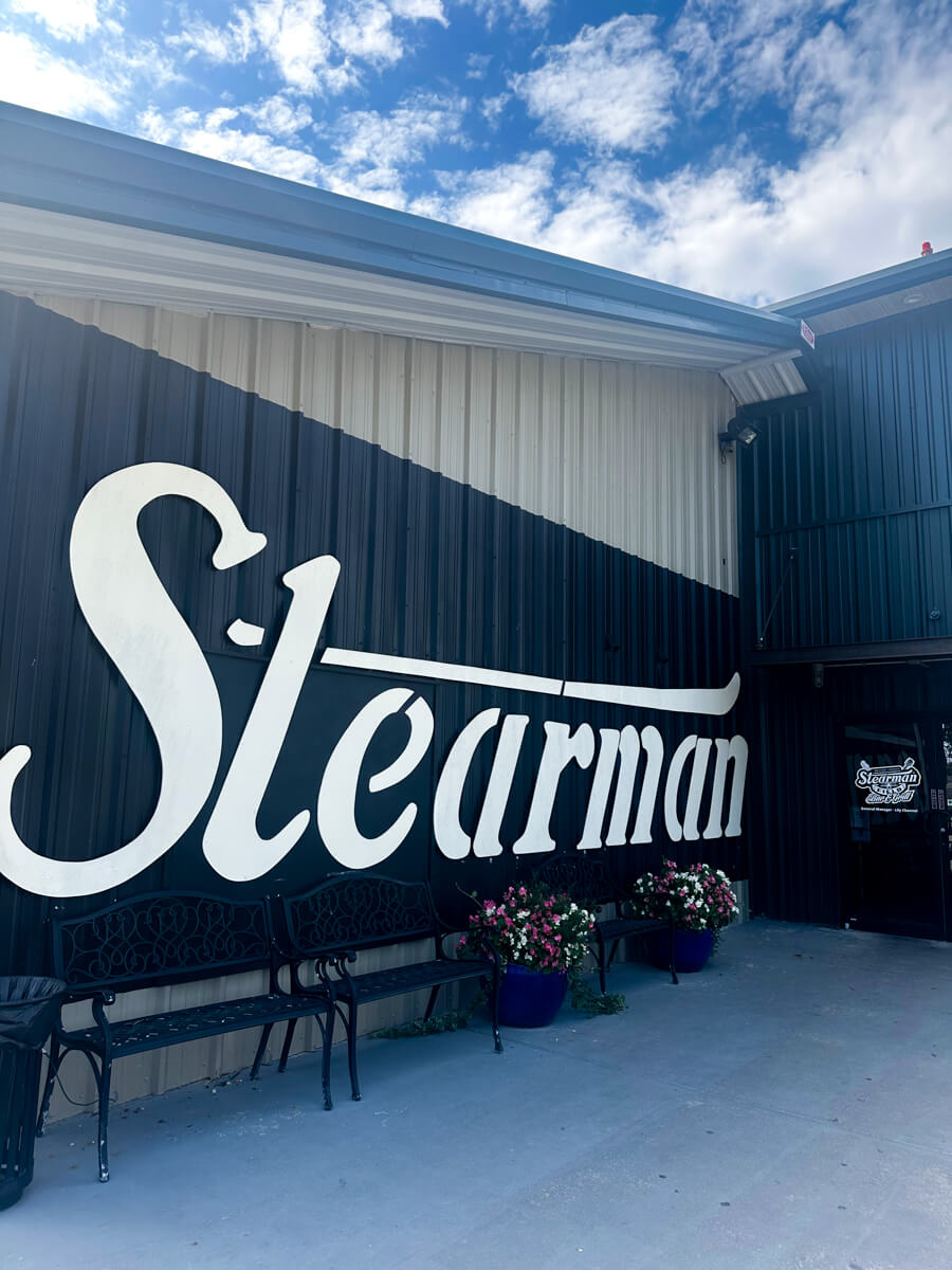 Side view of the wall with the large white word: Stearman