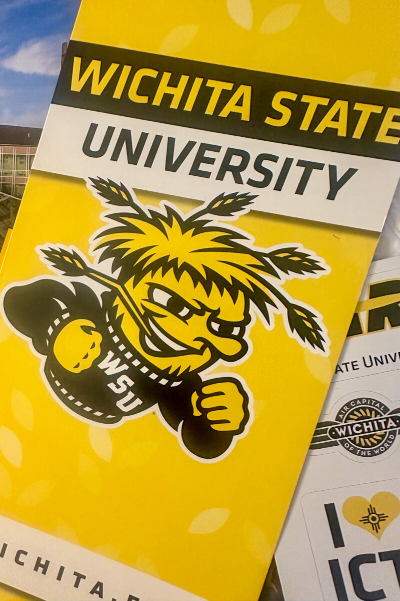 Yellow flyer for Wichita State University with the school's mascot WuShock