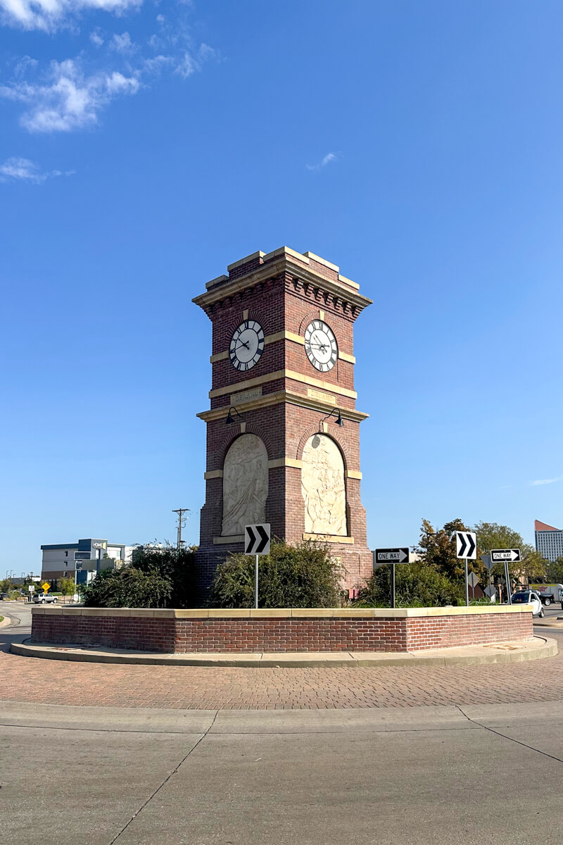 The red brick clock tower at the center of the roundabout in Delano