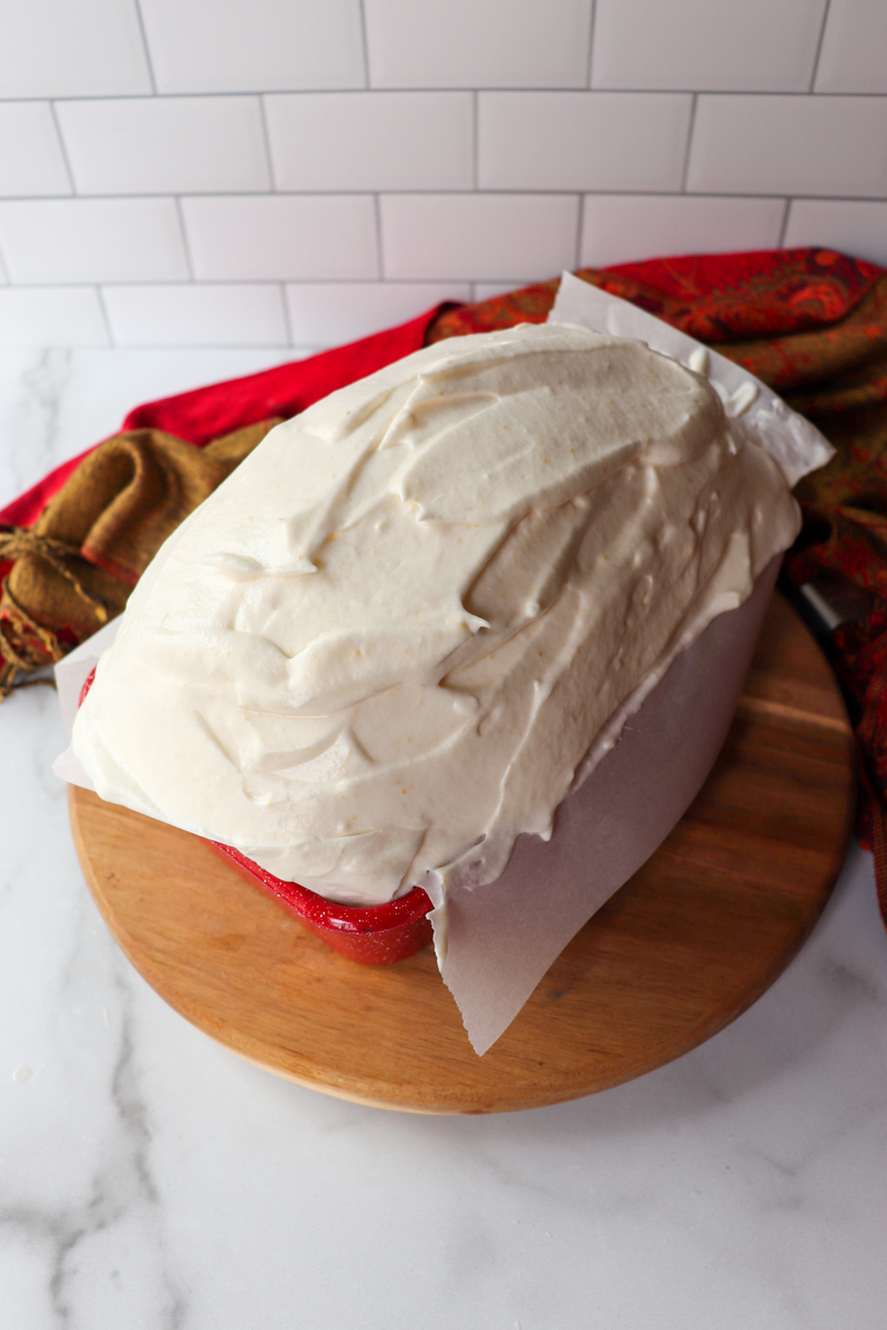 Front view of keto bread batter in a red pan