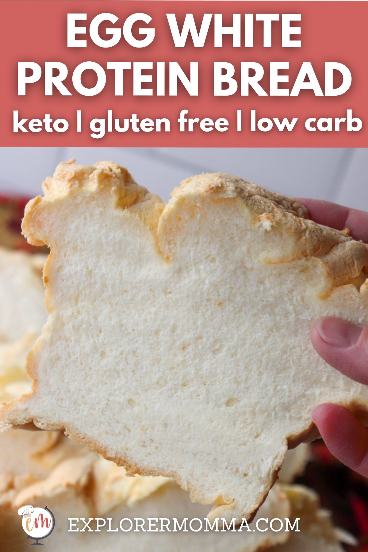 A hand holding up a piece of gluten free egg white protein bread with text overlay, "Egg White Protein Bread"