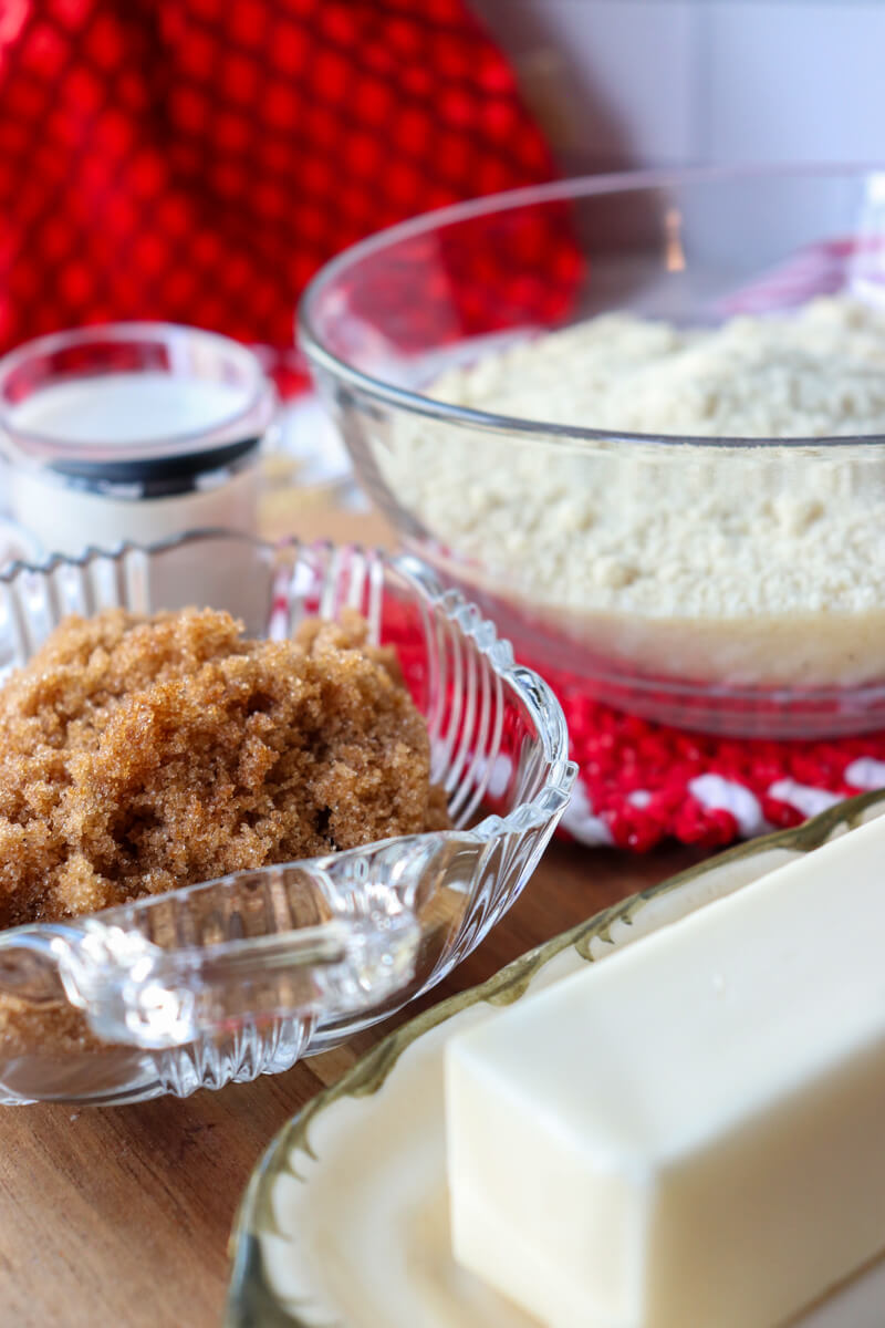 Glass bowls of brown sweetener, almond flour, etc.