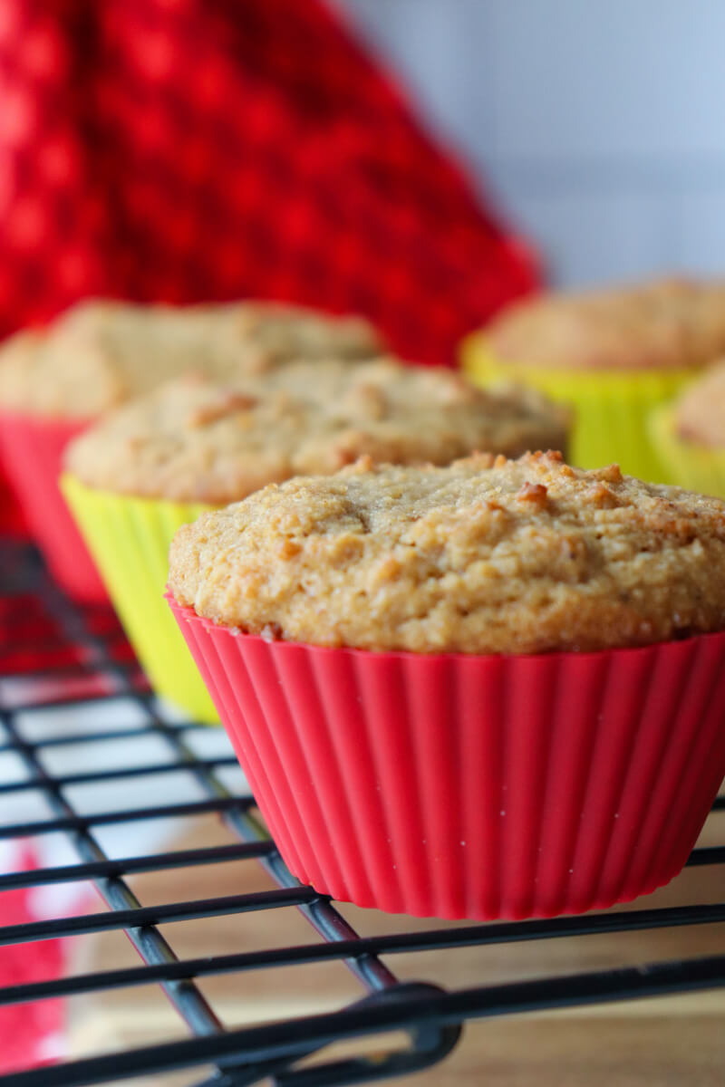 Front close up view of keto gingerbread muffins on a metal cooling rack
