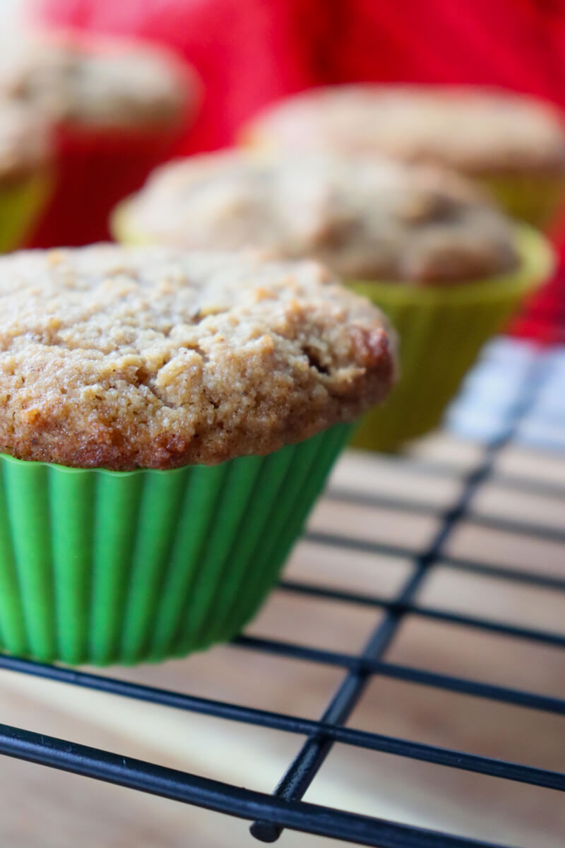 Front close up view of keto gingerbread muffins on a metal cooling rack