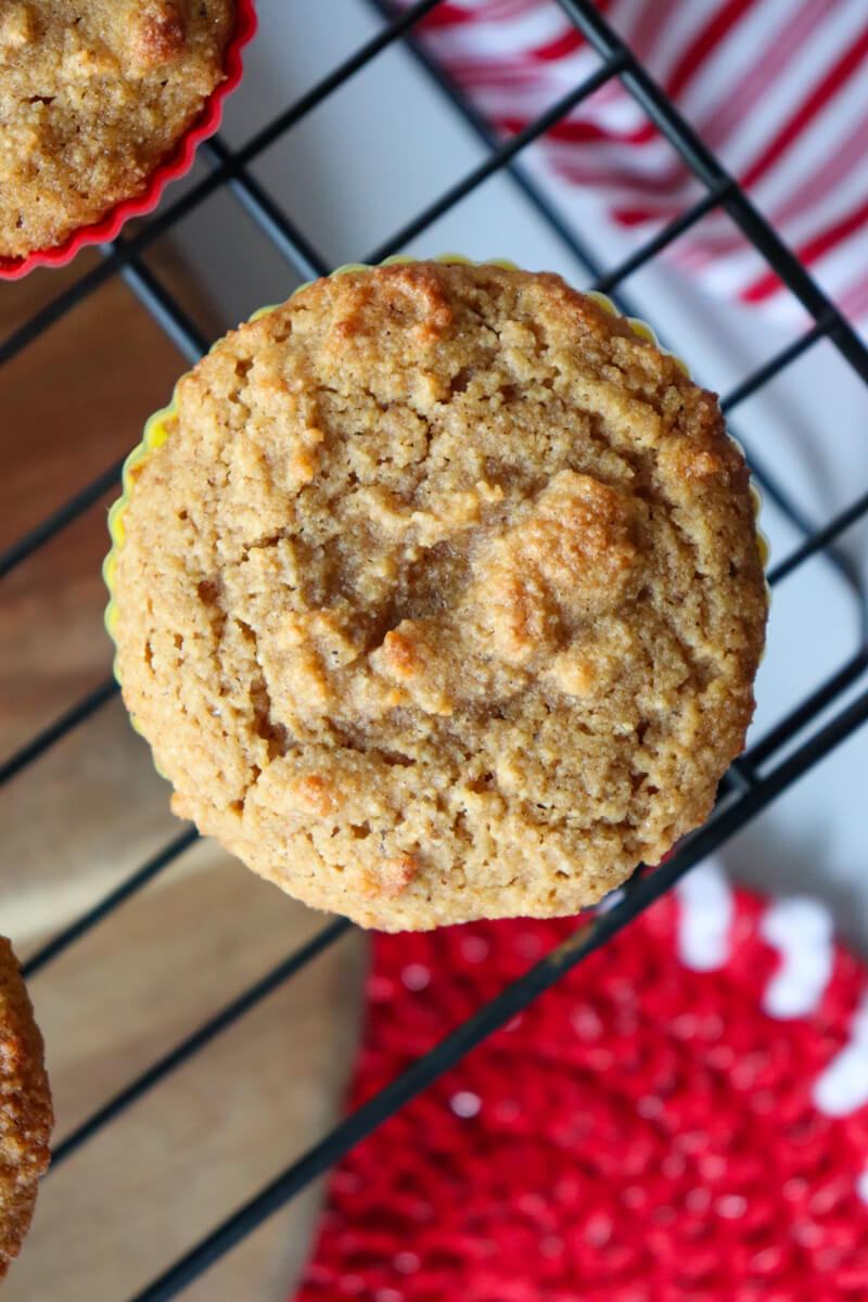 An overhead view of a low carb gingerbread muffin on a metal cooling rack