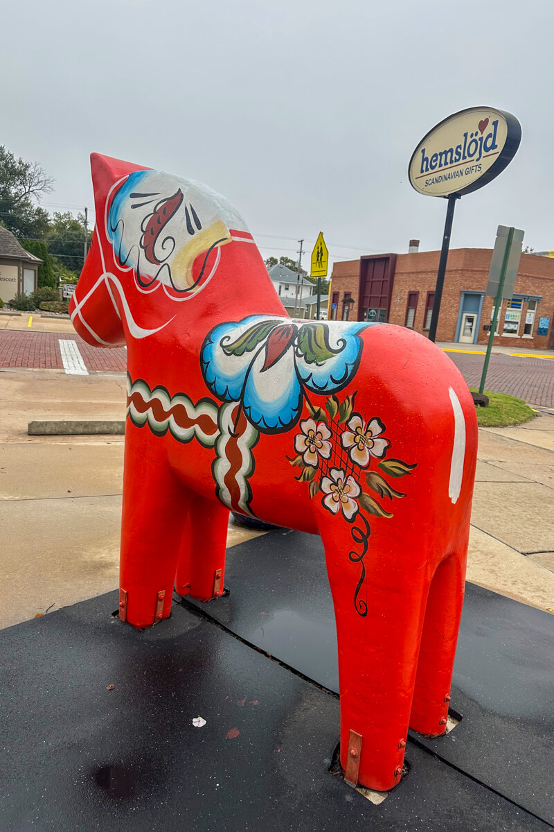 A view from the back of a full-sized Dala horse looking to the street