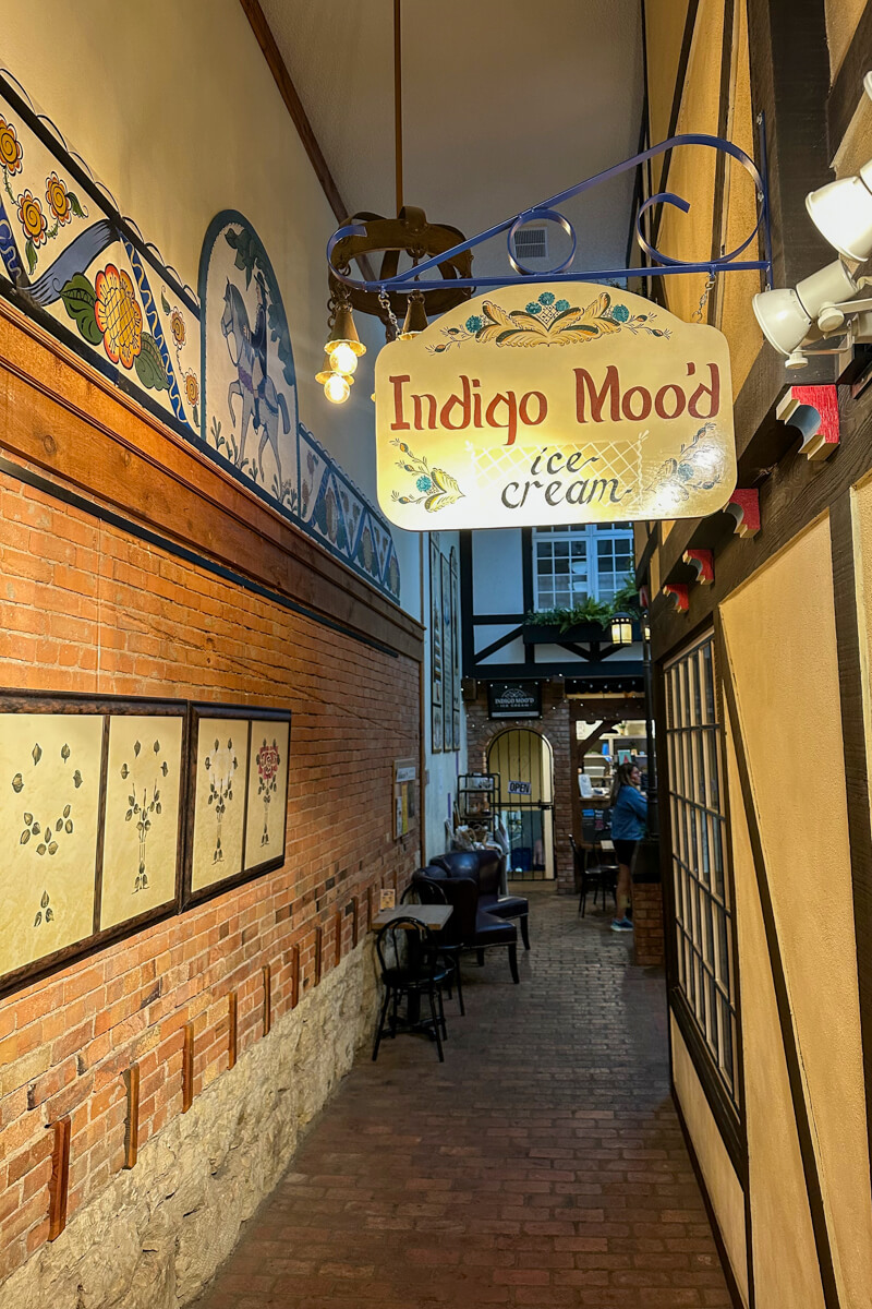 Indoor market hallway with a sign that's written Indigo Mood