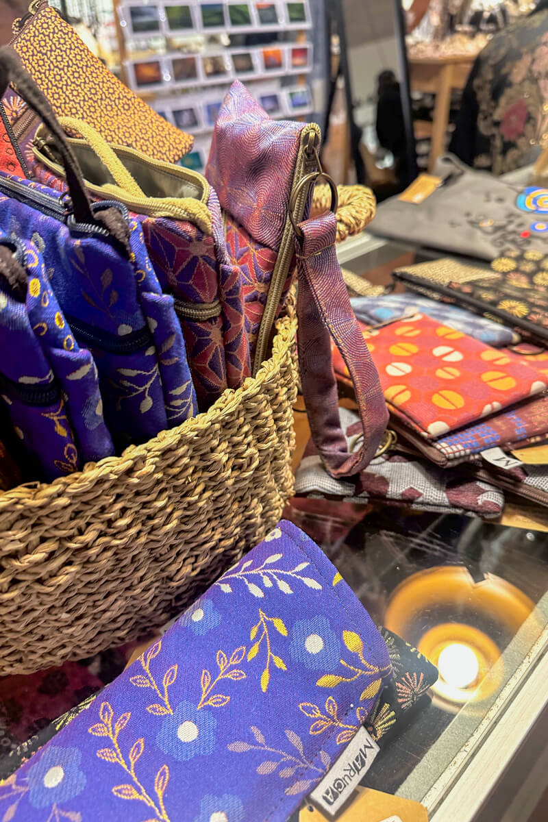 A table with handmade textile items in a basket