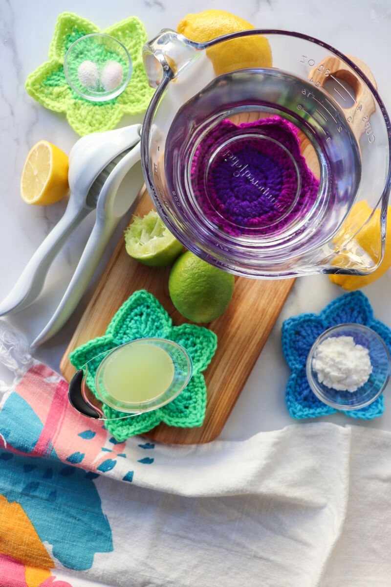 Overhead view of ingredients in the homemade electrolyte drink recipe on a wooden cutting board, etc.