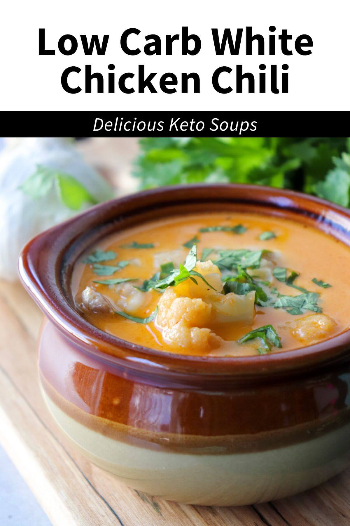 Front view of a brown ceramic bowl of keto white chicken chili with chopped cilantro. Text overlay: Low Carb White Chicken Chili, Keto | Gluten Free
