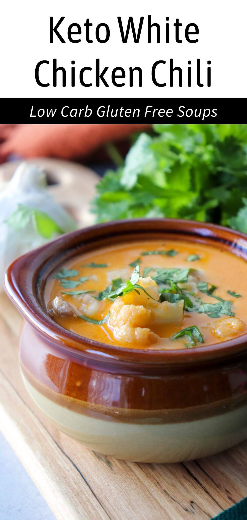 Overhead view of a brown ceramic bowl of keto white chicken chili with chopped cilantro. Text overlay: Keto White Chicken Chili, Low Carb | Gluten Free