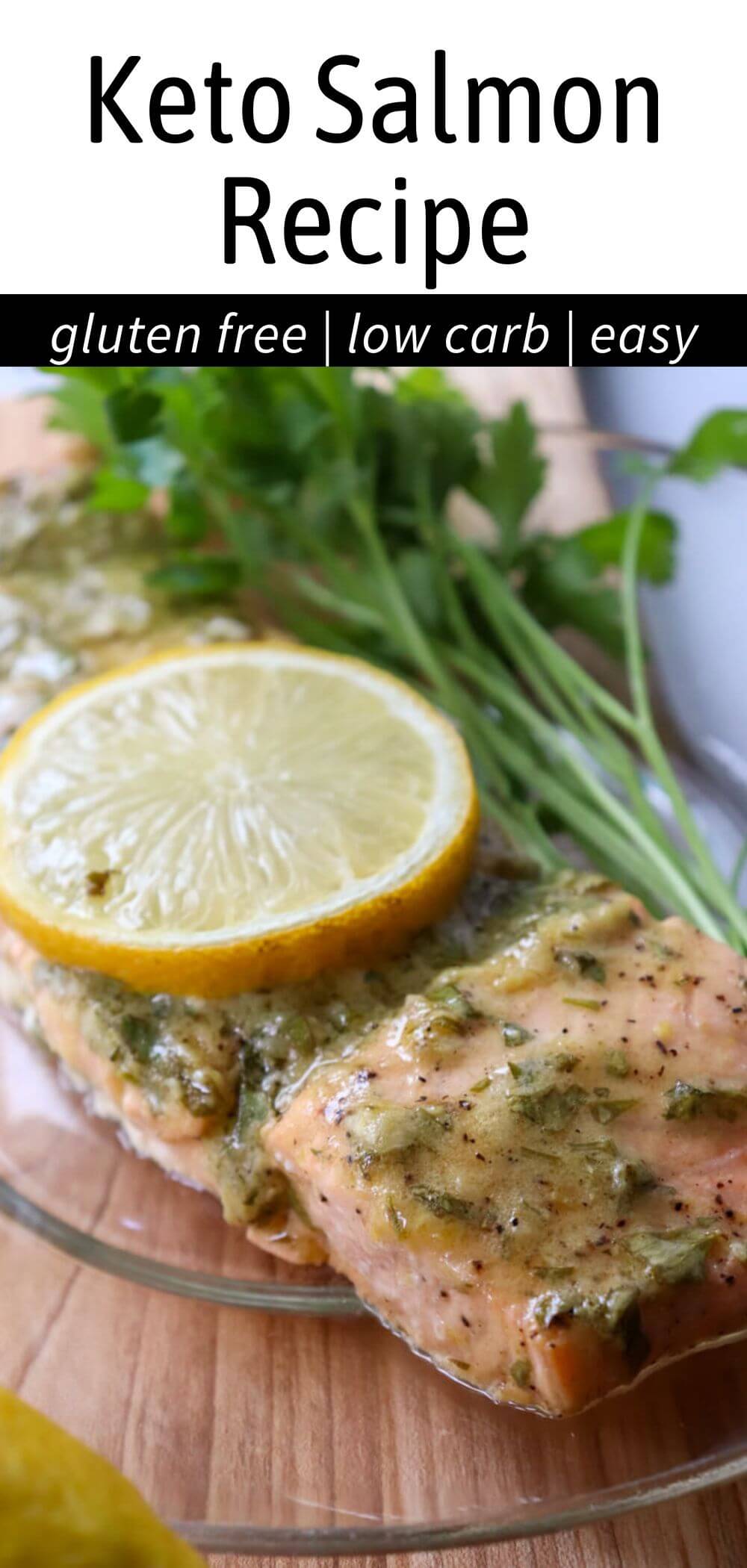 Close-up of a serving of keto baked salmon with a lemon dijon sauce on a glass plate on a wooden cutting board; text overlay, "Keto Salmon Recipe, gluten free, low carb".