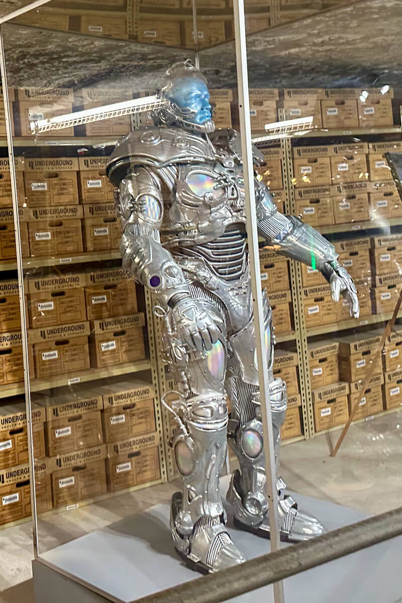 Terminator movie costume displayed in underground storage vault at Strataca Salt Mine in Hutchinson Kansas with archival boxes behind glass