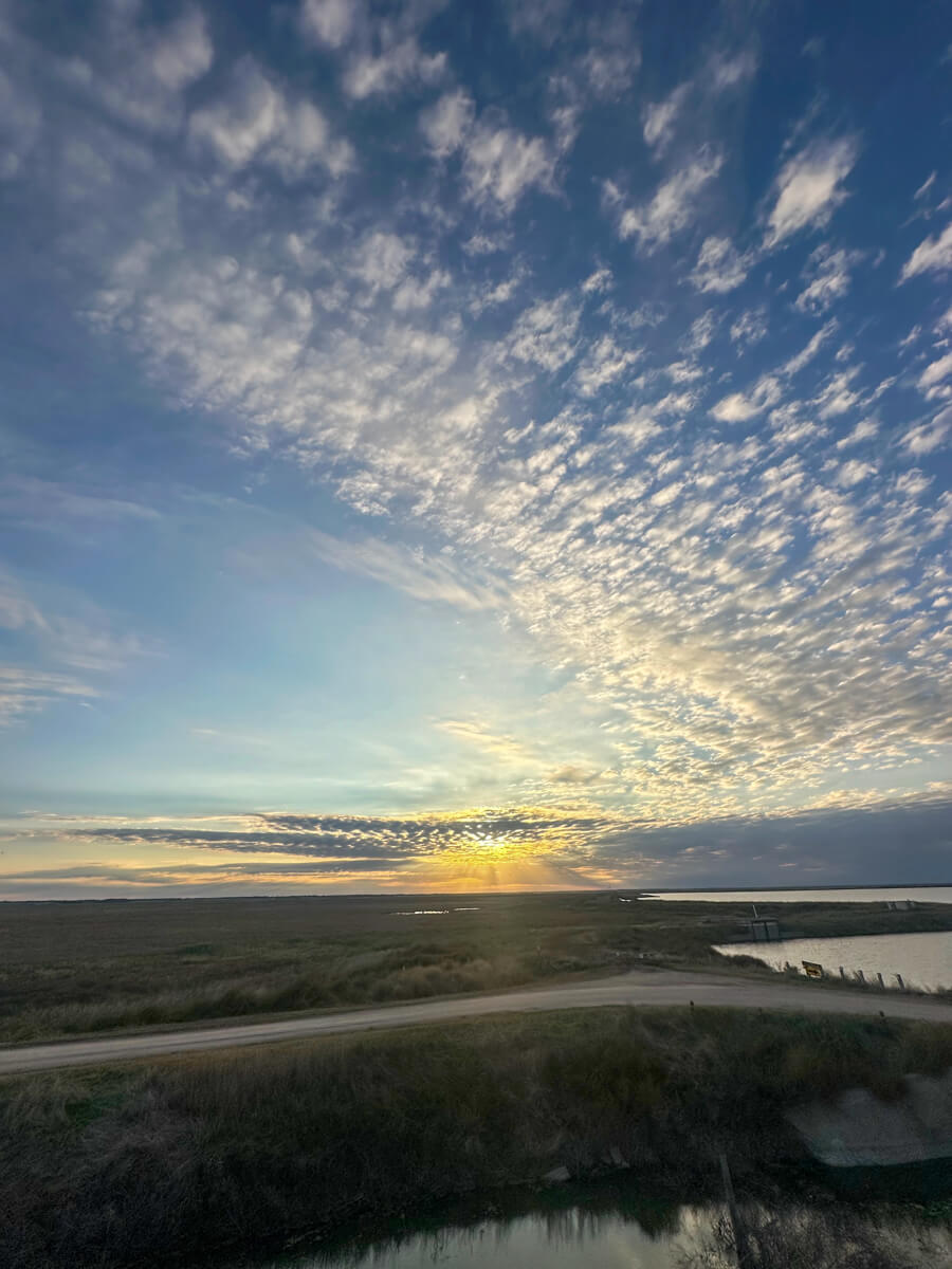 Kansas prairie sunset over wetlands