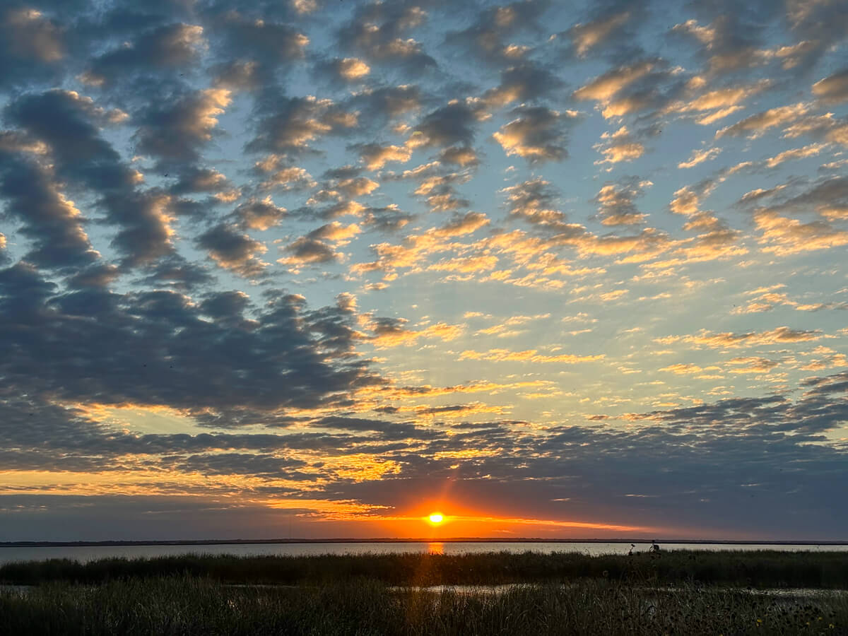Kansas prairie sunset over wetlands