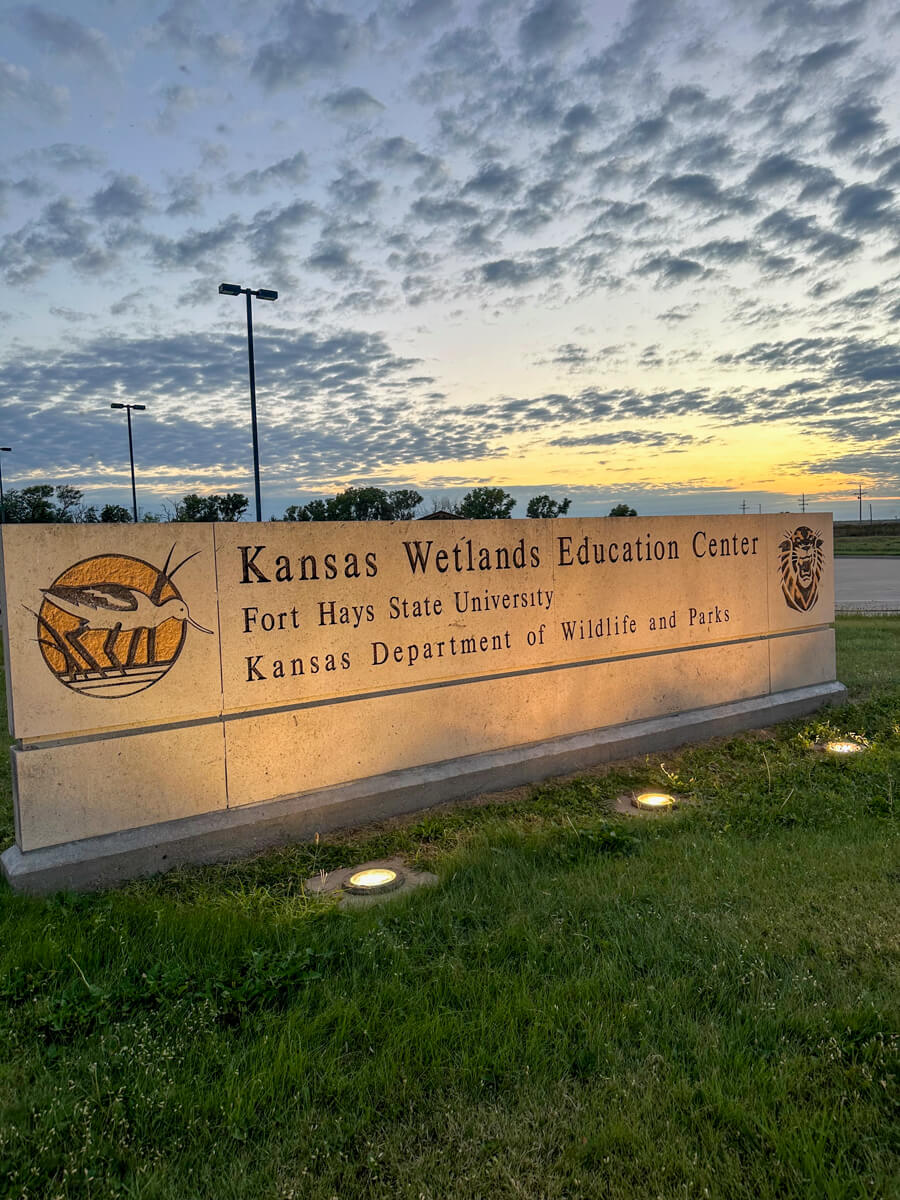 Sunset view of the Kansas Wetlands Education Center sign
