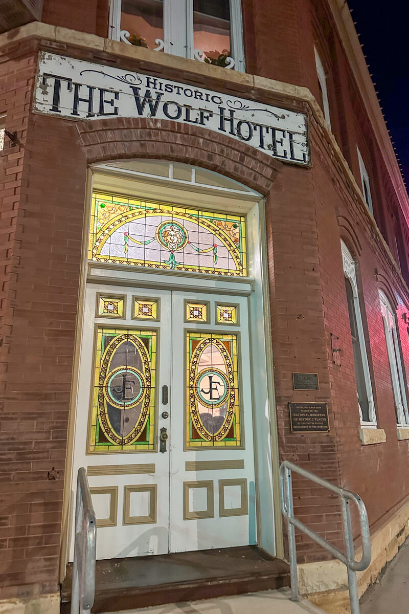 Front door view of the Wolf Hotel in Ellinwood, Kansas