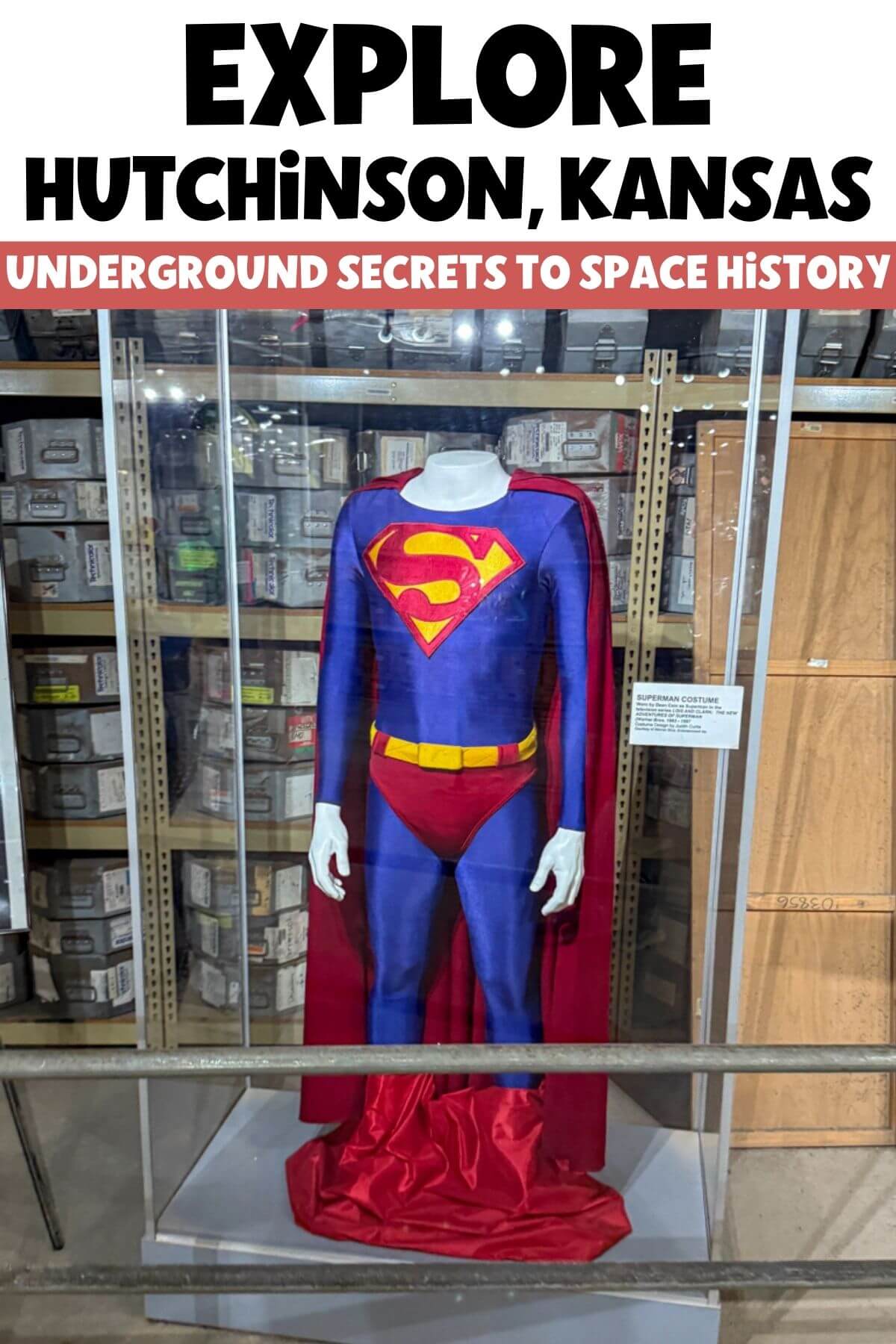 Superman movie costume displayed in underground storage vault at Strataca Salt Mine in Hutchinson Kansas with archival boxes behind glass