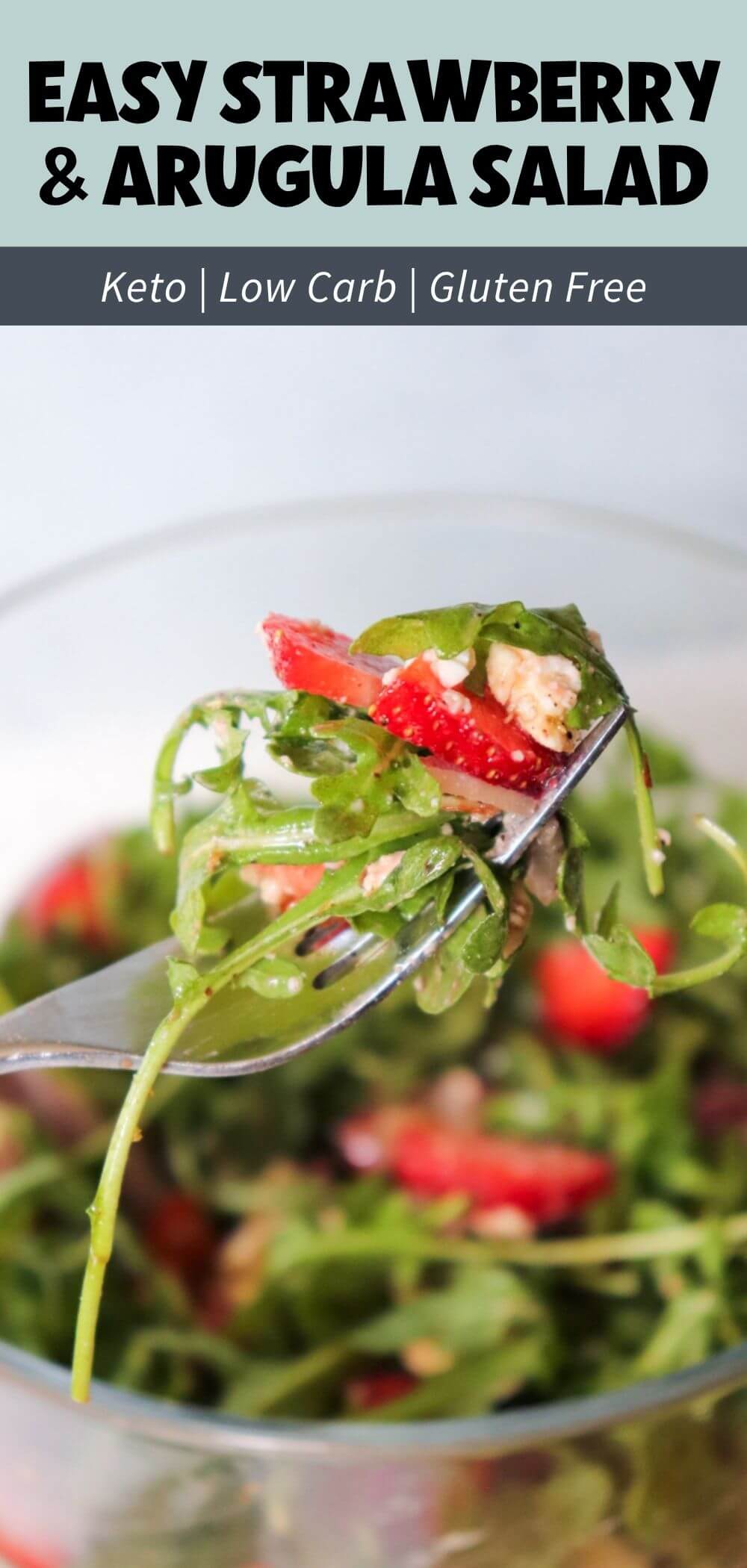 Forkful of Strawberry Arugula Salad with fresh arugula, sliced strawberries, goat cheese, and almonds in a low-carb gluten-free spring salad.