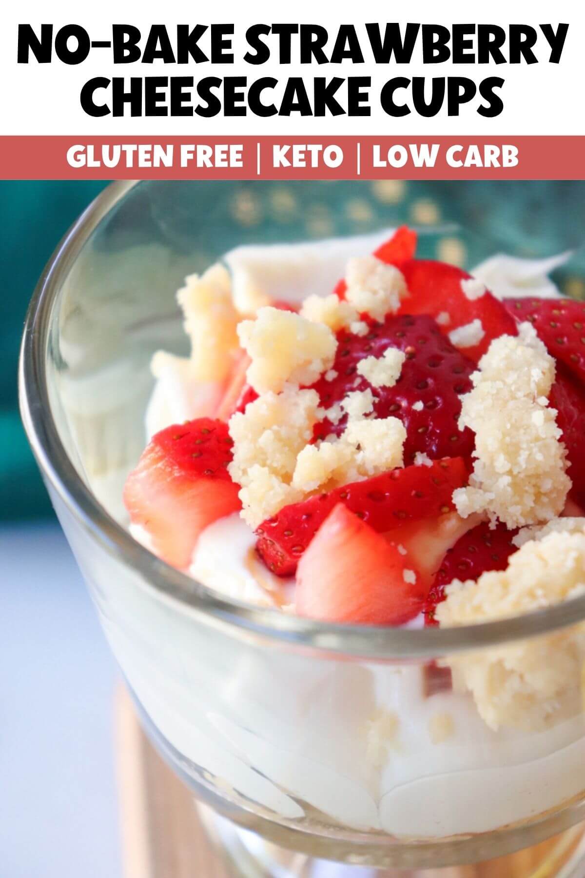 Close-up of keto no-bake strawberry cheesecake cup with creamy cheesecake filling, fresh strawberries, and almond flour crumble topping.