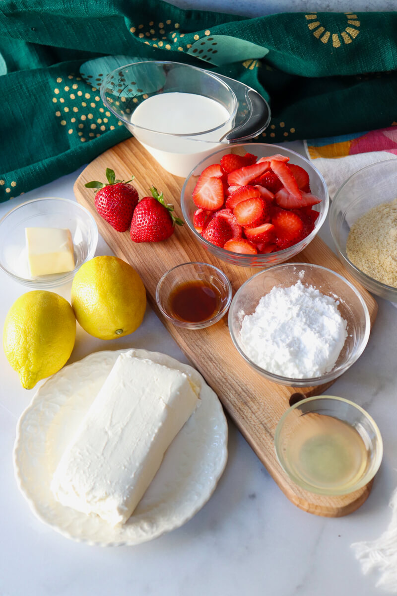 Overhead view of ingredients in keto no bake strawberry cheesecake cups.